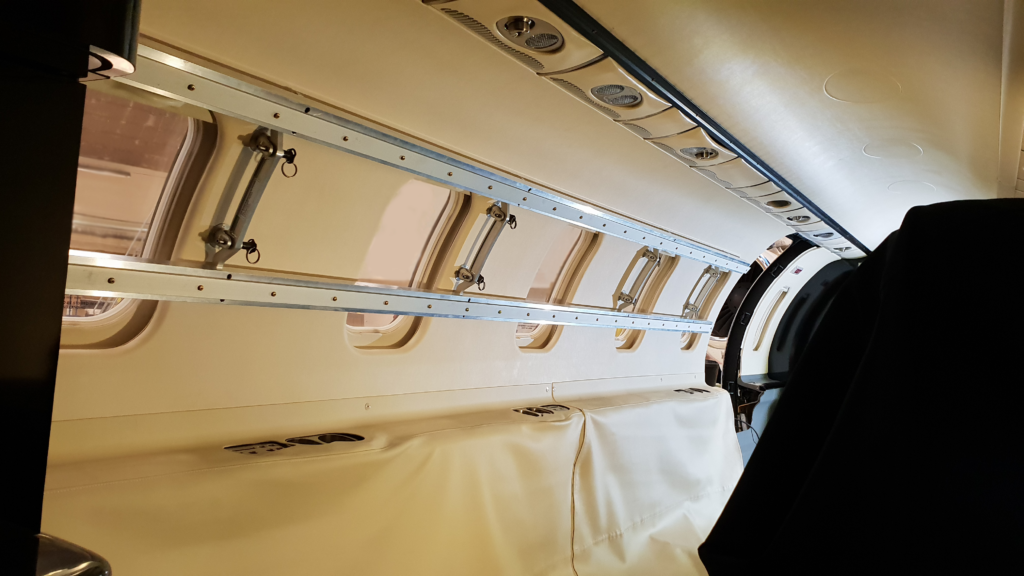 BAM Learjet 45 medical rack mounted on the RH upper sidewall for suspending medical equipment